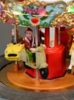 New Christmas Warehouse Kids Enjoying A Winter Fun Park Merry-Go-Round Christmas Village Scene - 23Cm